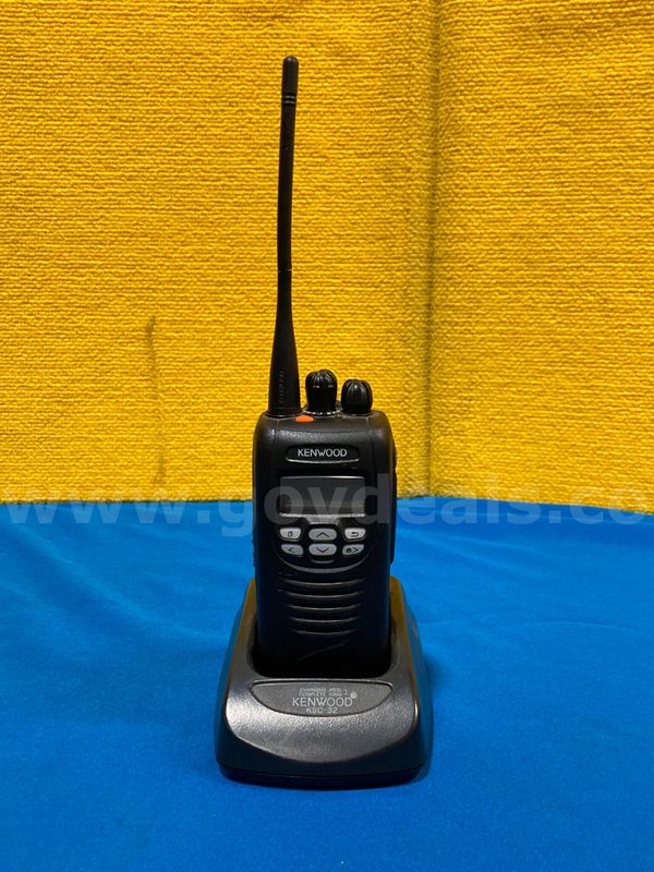 (1) Kenwood NX-300-K Digital and Analog Portable radio, (1) Charging Dock
