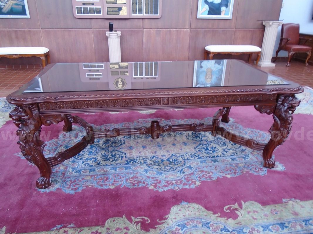 Ornately carved Renaissance style dining table (with glass topper))