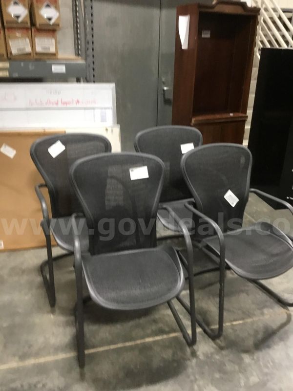 4 Black mesh sled base arm chairs