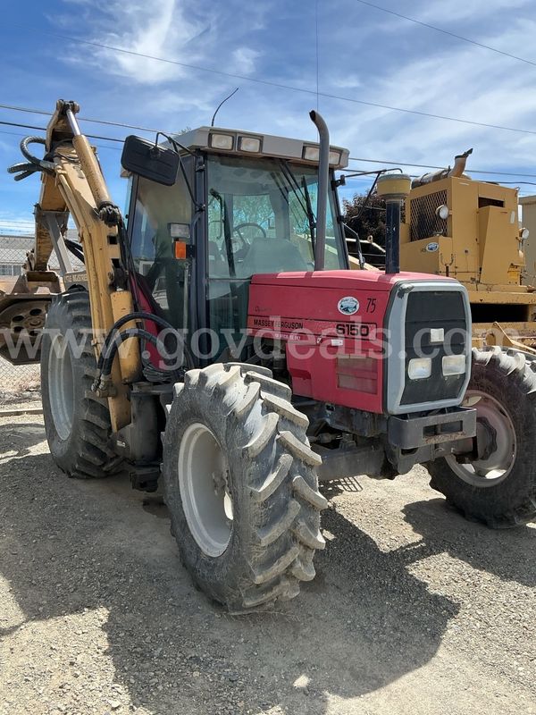 1997 Massey Ferguson 6150 tractor (red) with a tiger boom mower attachment