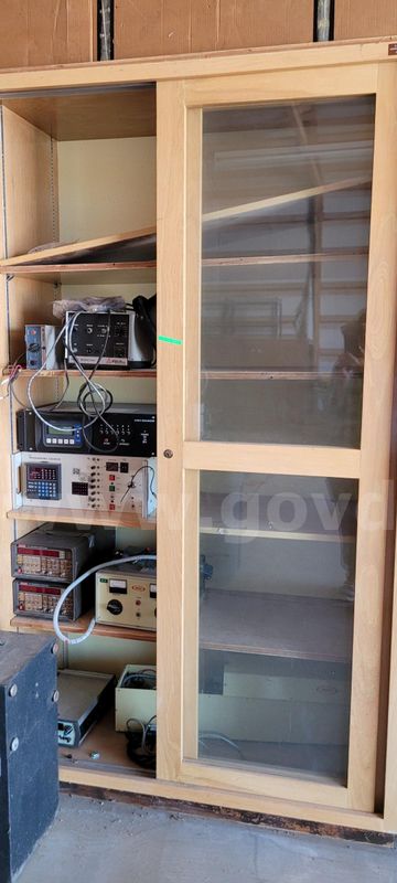 Wooden cabinet with sliding glass doors