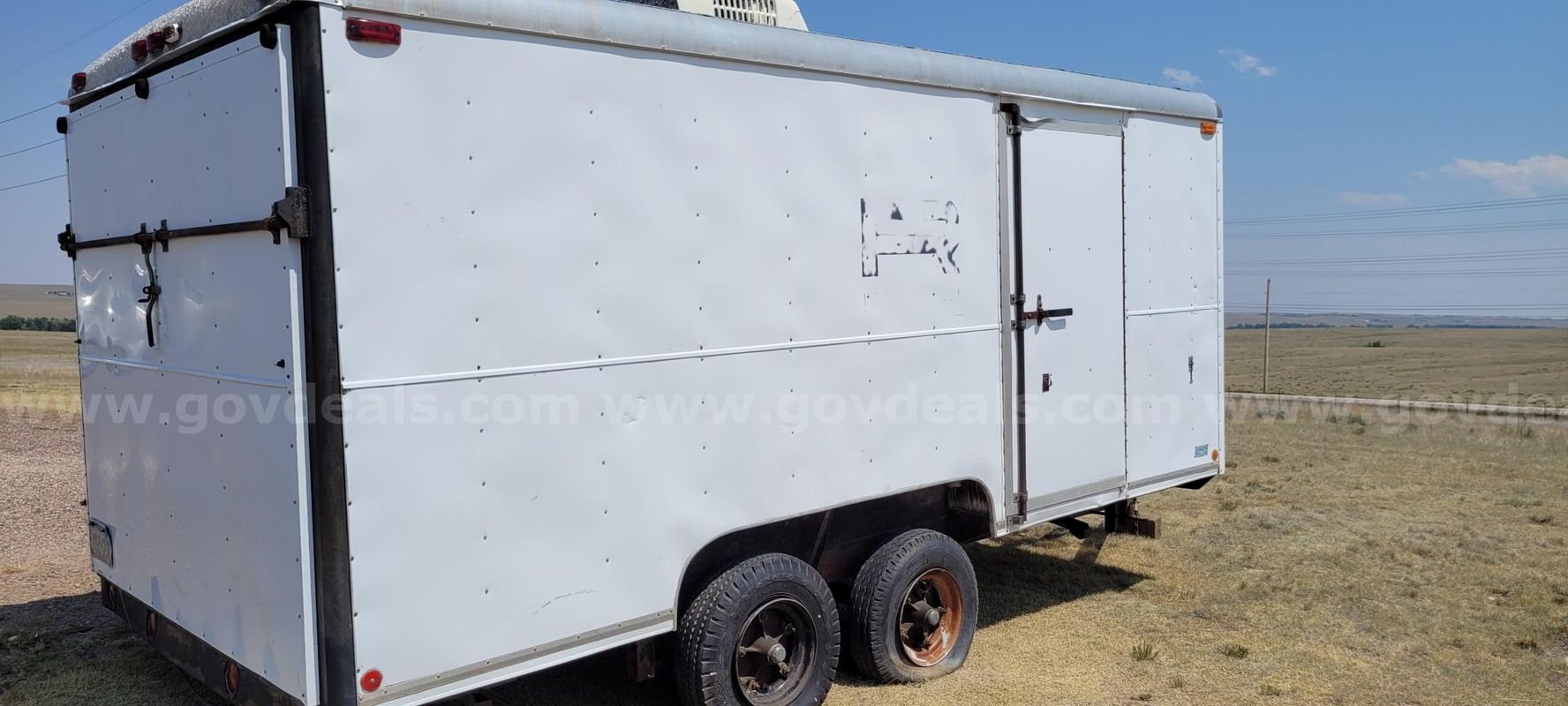 16 ft White Enclosed Wells Cargo trailer, contents included