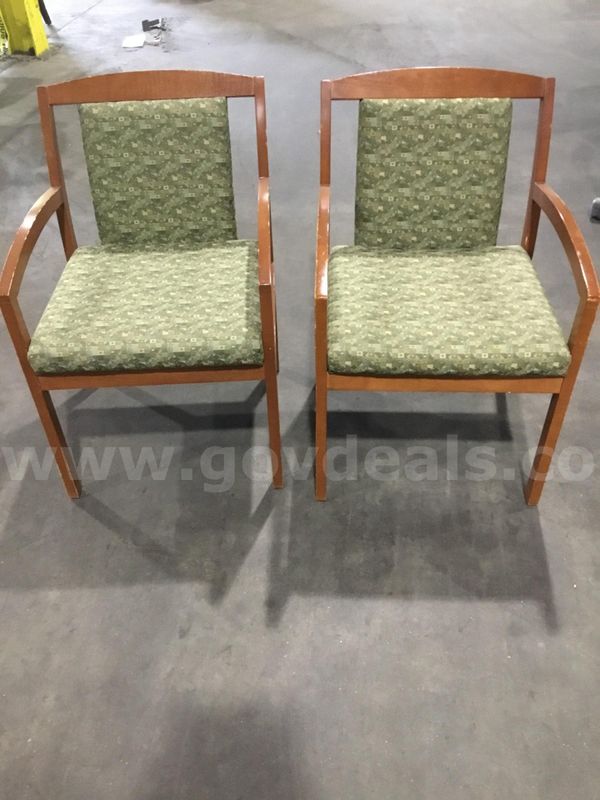Two multi green standard chairs; with dark brown hardwood armrests "DH"