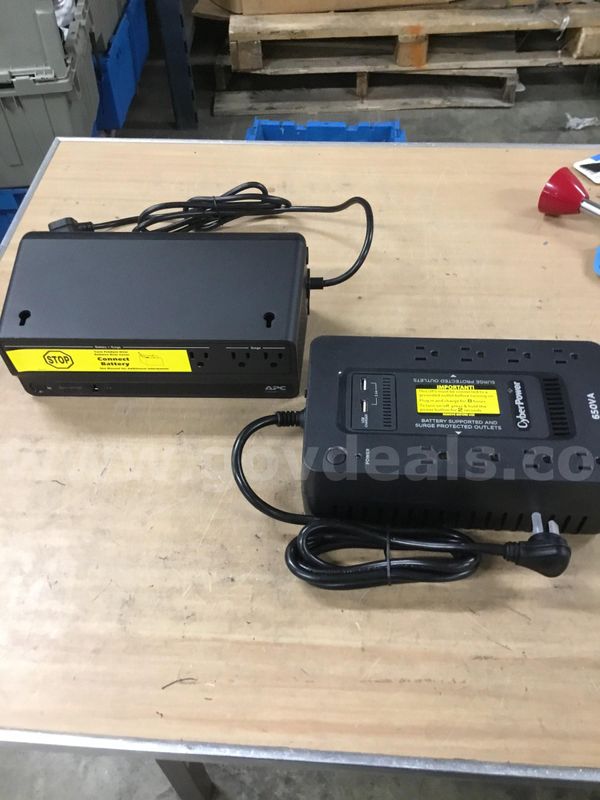 9 1/2 x 6 black Cyberpower 650VA battery backup, & a 10 x 5 1/2 black APC battery backup "DH"