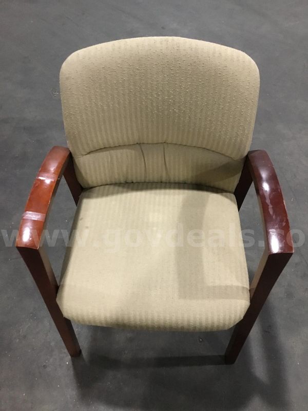 Light tan chair; with dark mahogany hardwood armrests "DH"