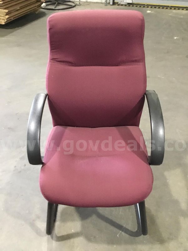 Burgundy chair; with black padded armrests "DH"