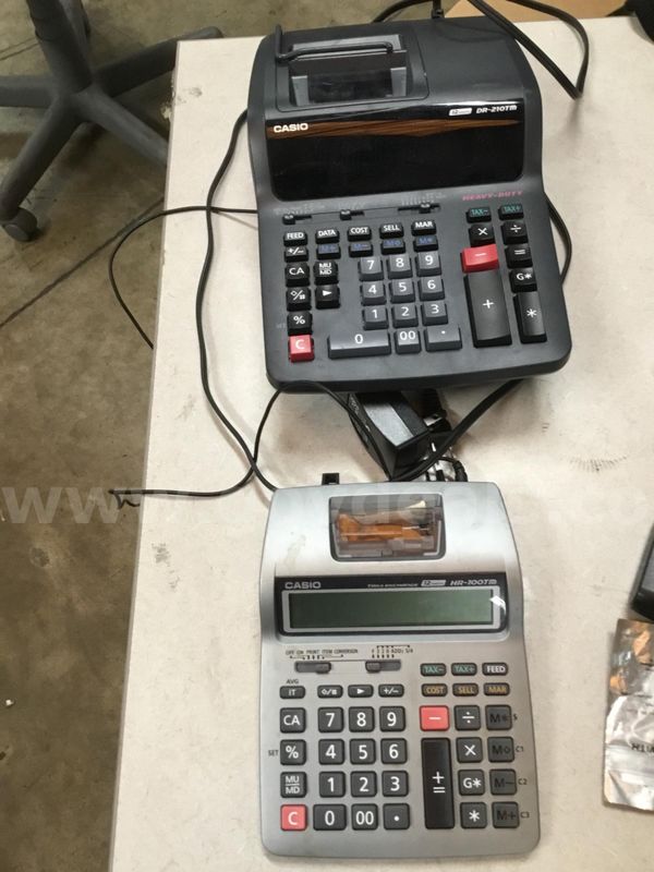Black Casio calculator & a dark gray Casio calculator (BATTERIES INCLUDED) “DH”