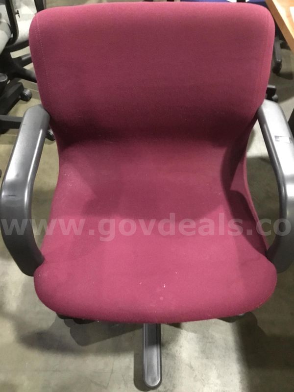 Red velvet adjustable chair; with black padded armrests “DH”