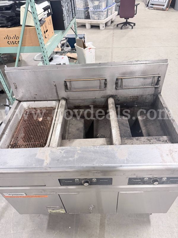 High-Efficiency, Open-Pot Gas Floor Fryer System featuring a built-in filtration unit.