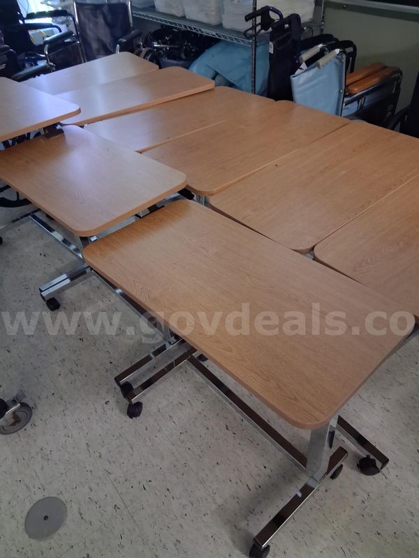 Lot of 9 Bed tables.