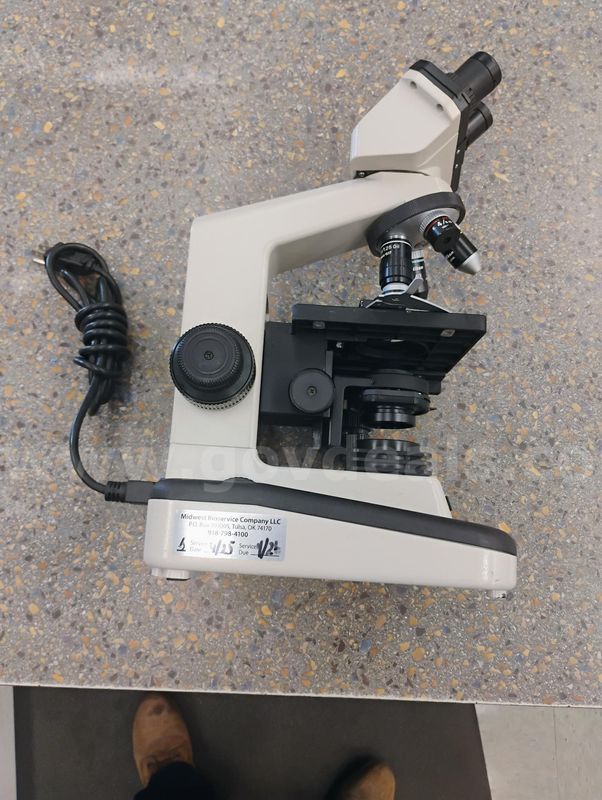 Microscope with light source