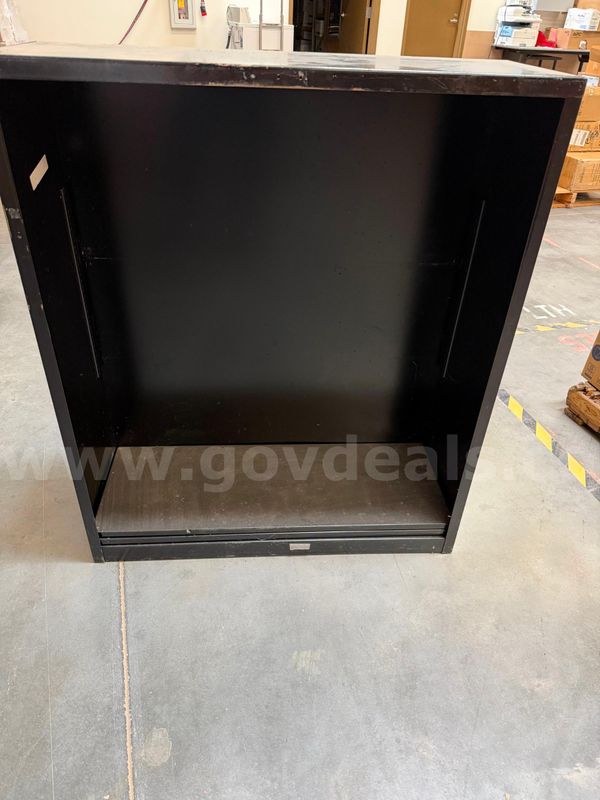 Three metal bookcases