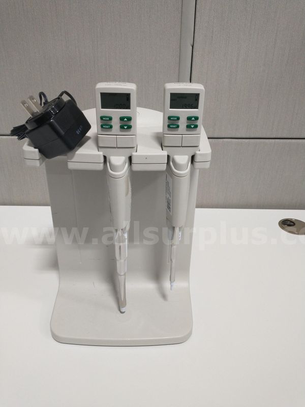 Electric Pipettes. 2-20 microliters and 0.1 to 1 mL with charging stand