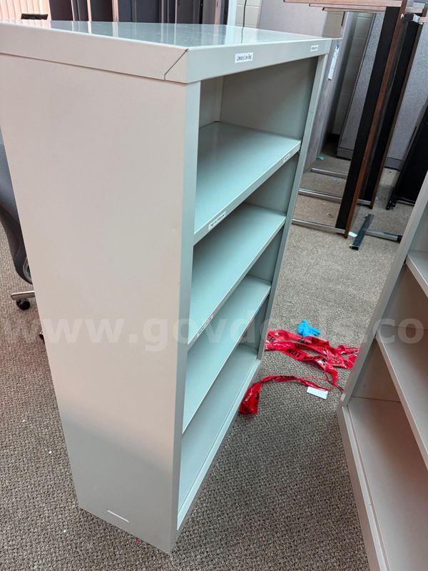 2 metal bookshelves and 1 black filing cabinet