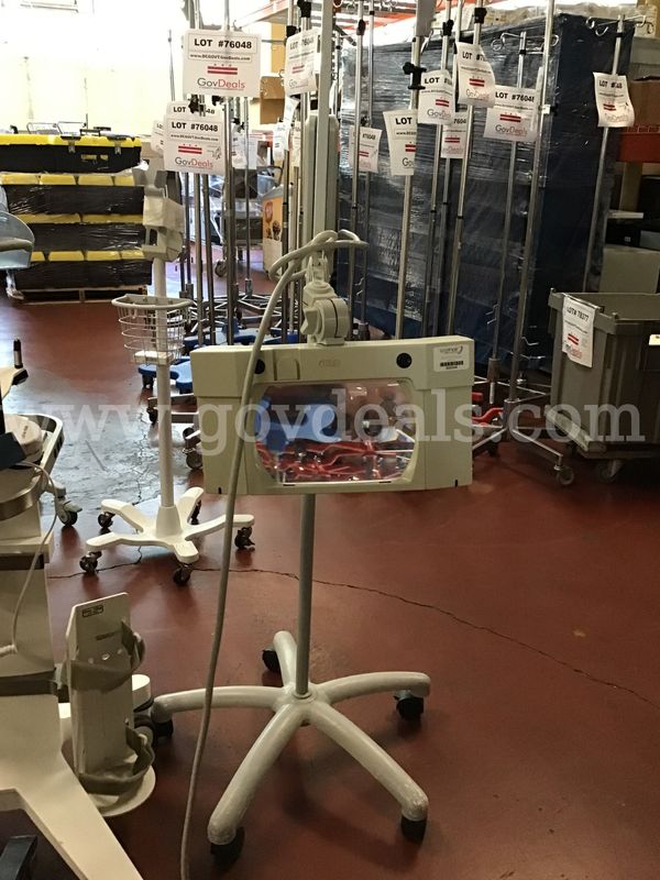 Lot of 14 - 9 monitoring machines Stands and 2 exam mirrors, 1 magnifying lights, 2 pumps