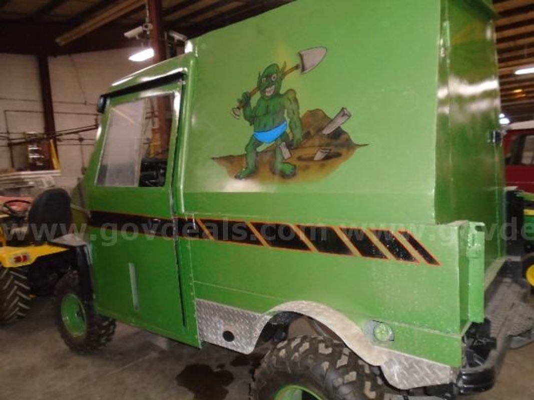 Lot of (1) Green Troll Cushman Cart