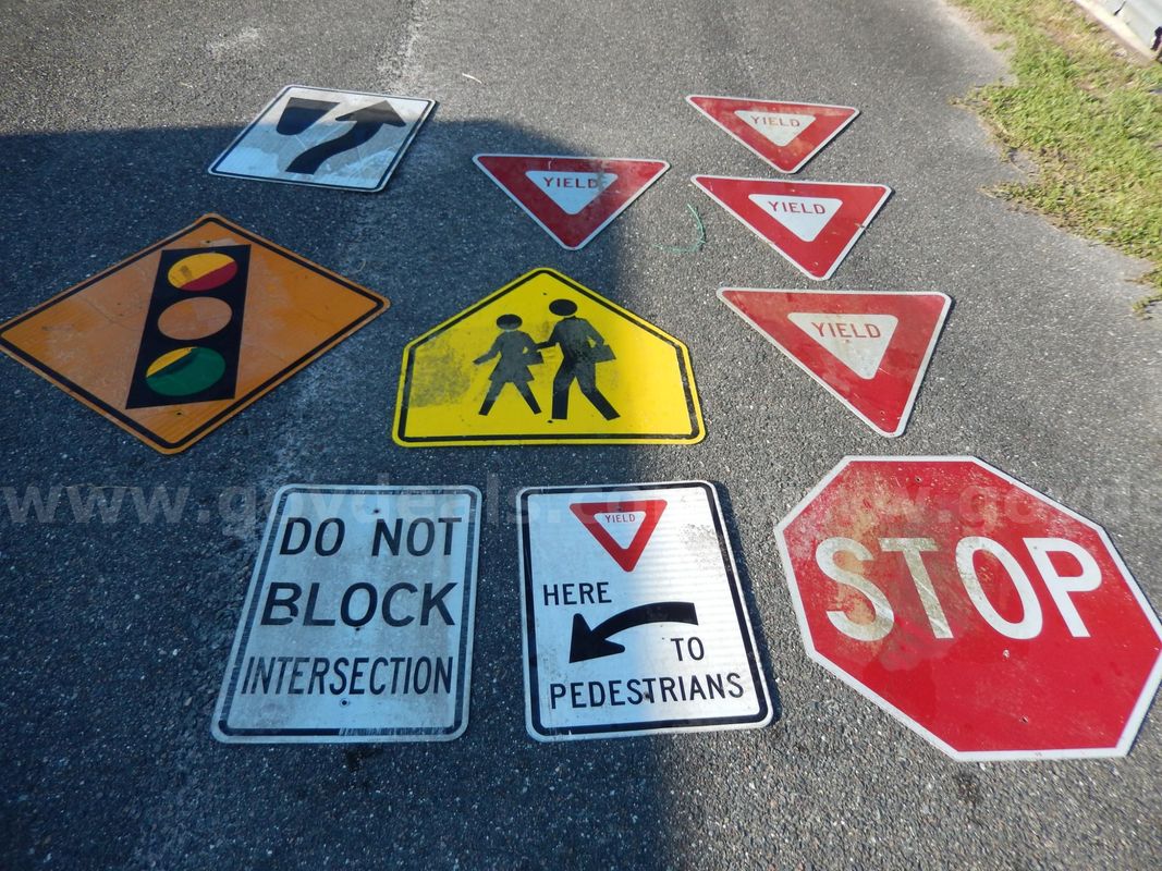 Used (4) Yield Signs, (1) Stop Sign, (1) Pedestrian Crossing Sign, (1) Right Of Median Sign, (1) Stop Light Sign