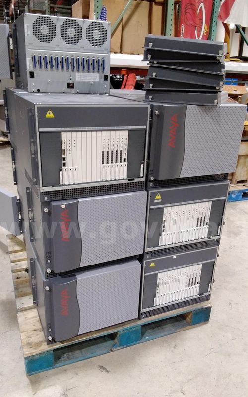 Lot of AVAYA phone system networking components.