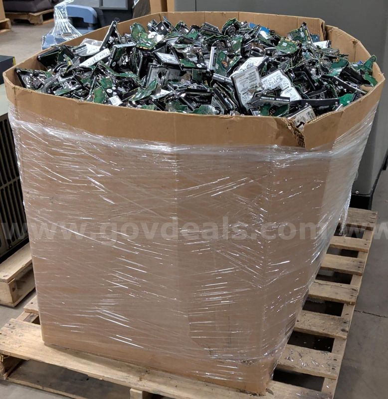 Bin of Punched Hard Drives (Scrap)