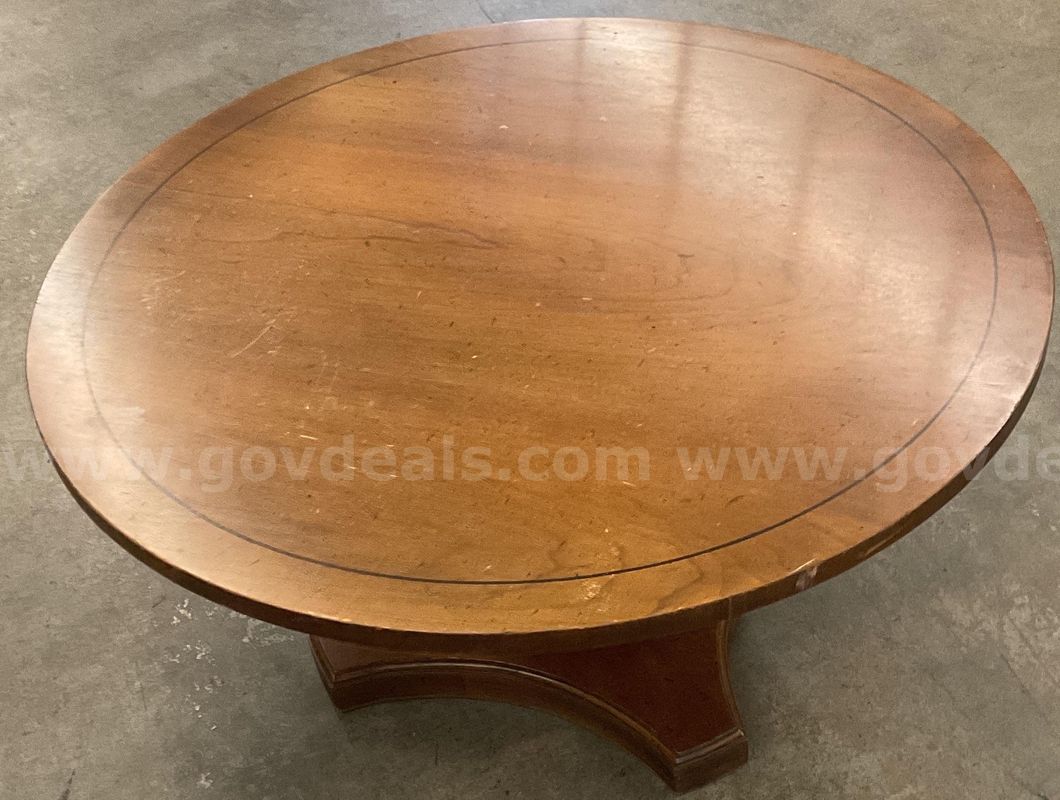 A wooden round table