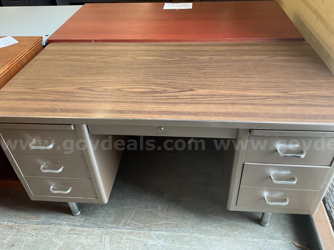 Beige Steelcase desk with wooden top