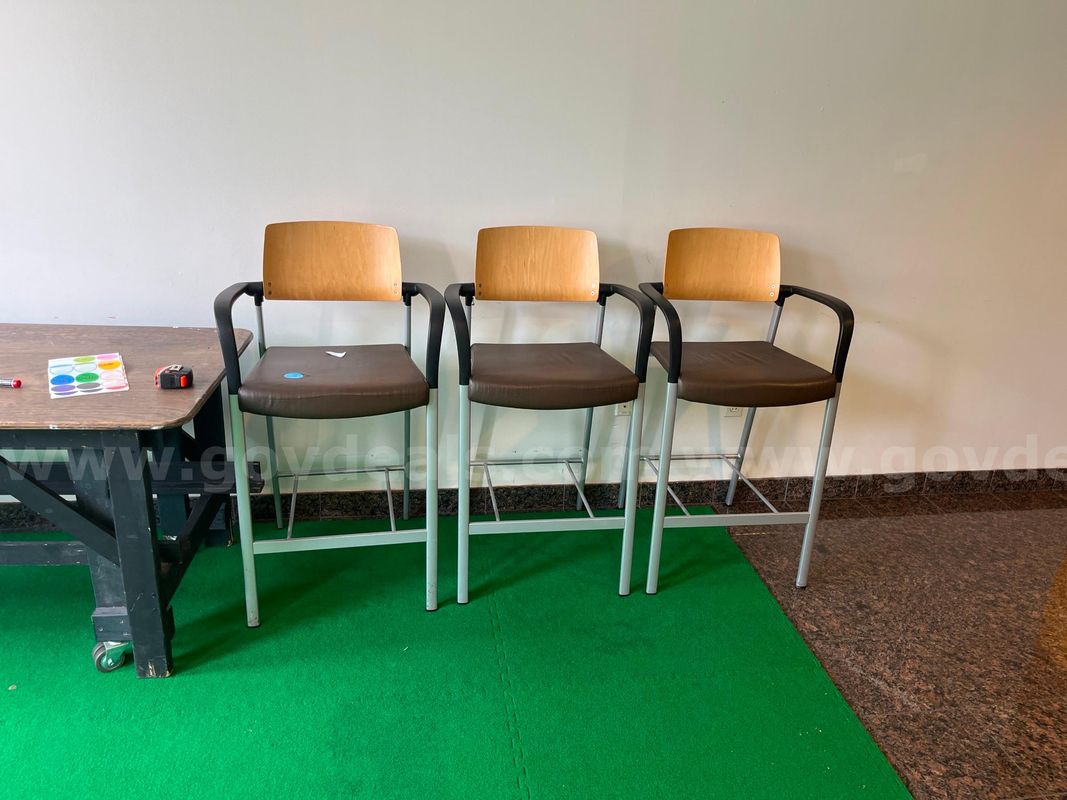 Set of three leather and wood high chairs