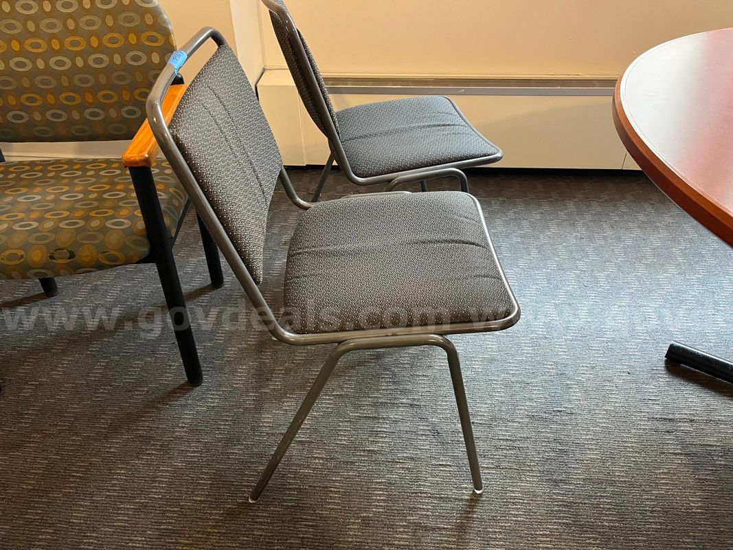 2 Metal chairs with grey cushions