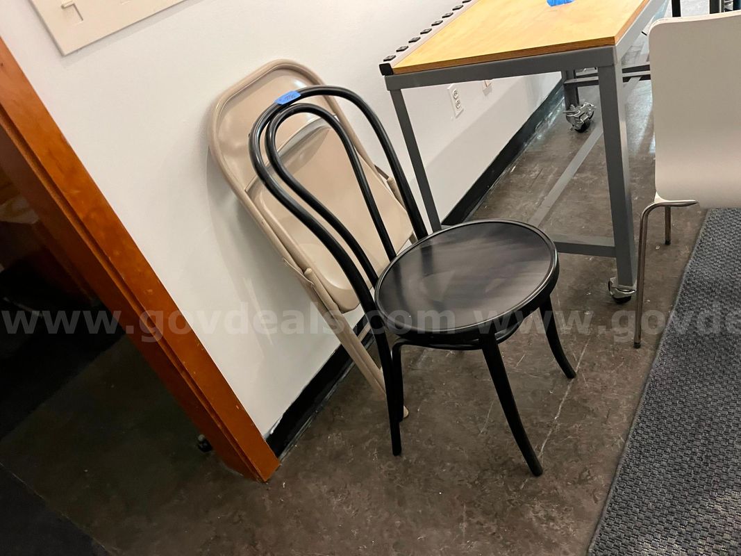 Black chair w/ looped metal back