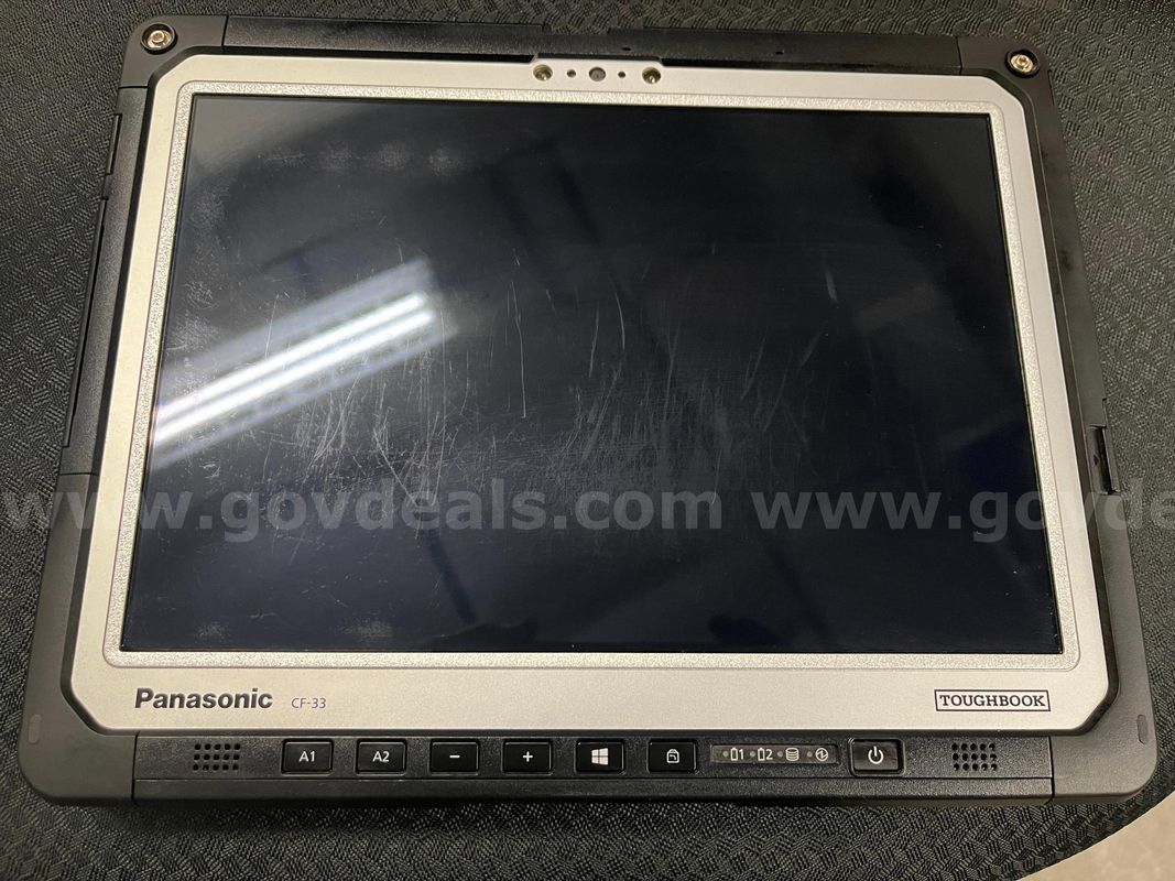 Lot of (7) Panasonic Toughbook CF-33 touchscreen PC's, includes 3 vehicle docking stations, keyboards, & power supply